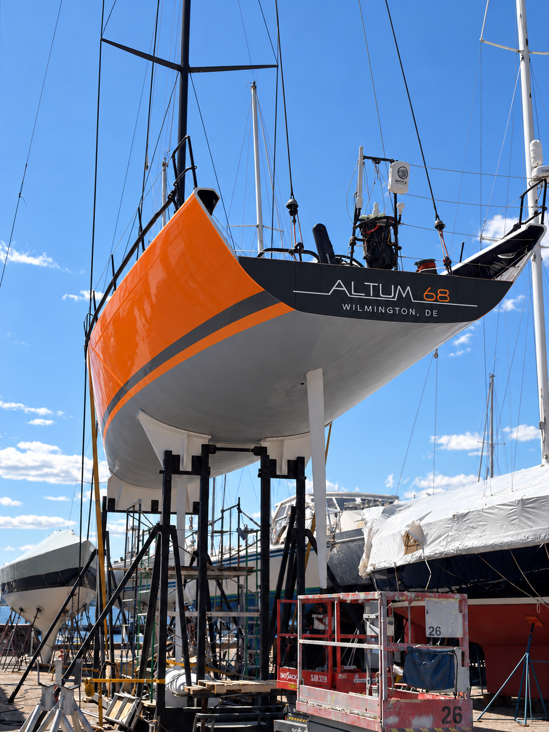 Client-supplied Altum 68 livery visualisation: the yacht ashore on its cradle, seen from the stern.